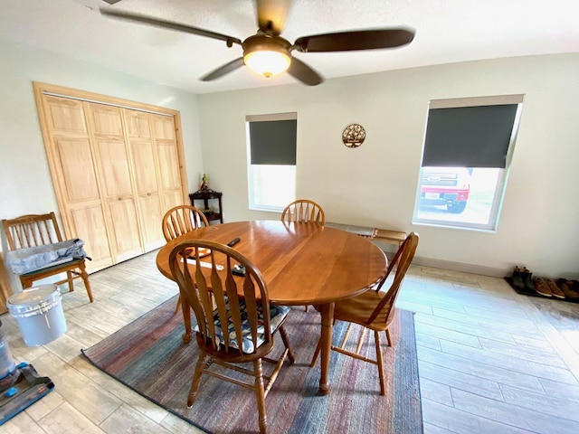 dining area featuring ceiling fan and light hardwood / wood-style floors