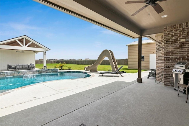 14770 Bond Rd, Beaumont, TX 77713 - view of pool featuring grilling area, a patio, a water slide, and pool water feature