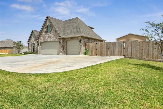 view of home's exterior featuring a garage and a lawn