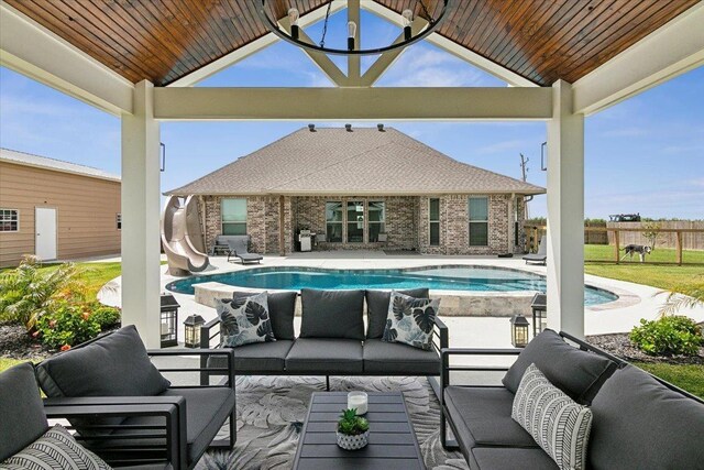 14770 Bond Rd, Beaumont, TX 77713 - view of patio / terrace featuring a fenced in pool and outdoor lounge area