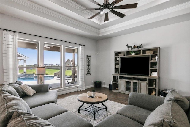 14770 Bond Rd, Beaumont, TX 77713 - living room featuring hardwood / wood-style floors, a tray ceiling, ornamental molding, and ceiling fan
