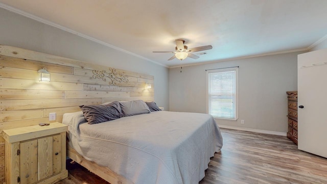 2418 Saba Ln, Port Neches, TX 77651 - bedroom featuring ornamental molding, wood finished floors, baseboards, and a ceiling fan