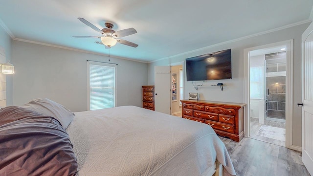 2418 Saba Ln, Port Neches, TX 77651 - bedroom featuring wood finished floors, ornamental molding, ceiling fan, and ensuite bathroom