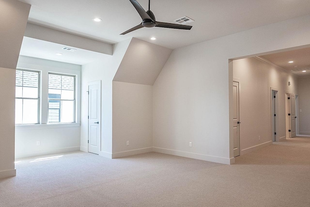 bonus room featuring light carpet, vaulted ceiling, and ceiling fan