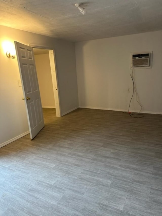 empty room featuring a wall unit AC