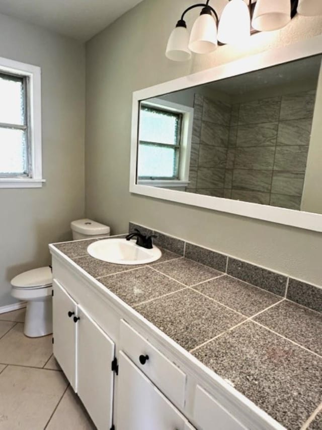 bathroom with tile patterned floors, vanity, and toilet