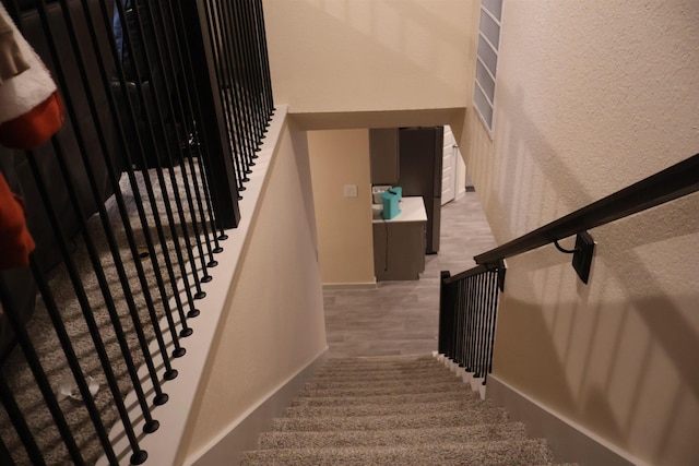 staircase featuring hardwood / wood-style floors