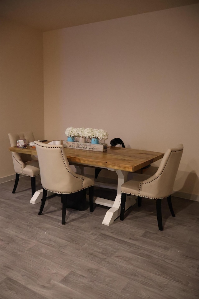 dining room with hardwood / wood-style flooring