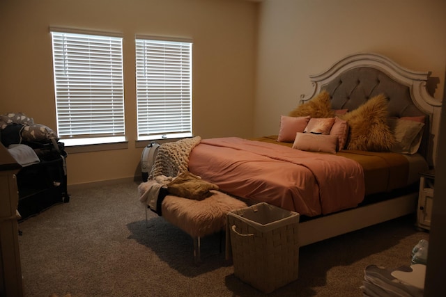 bedroom featuring dark carpet