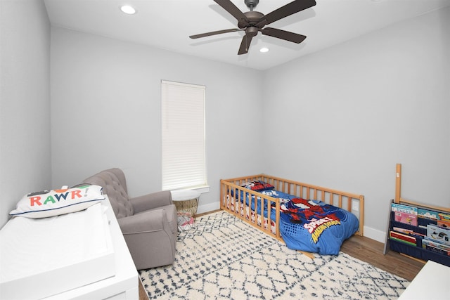 bedroom featuring ceiling fan and wood-type flooring