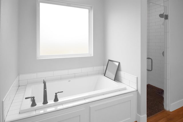 bathroom with wood-type flooring and shower with separate bathtub