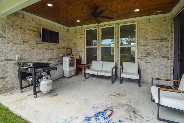 view of patio featuring a grill, ceiling fan, and an outdoor living space