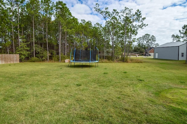 view of yard with a trampoline