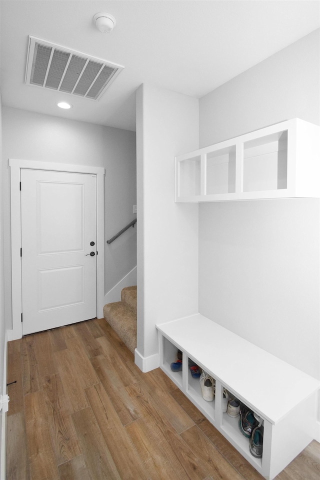 mudroom with hardwood / wood-style floors