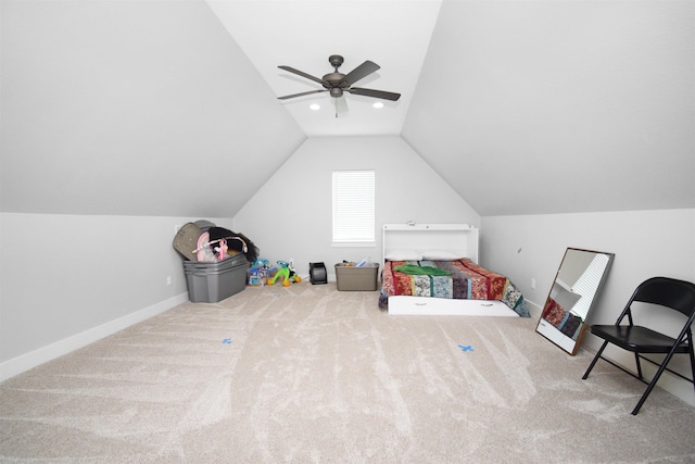 interior space featuring ceiling fan, carpet, and vaulted ceiling