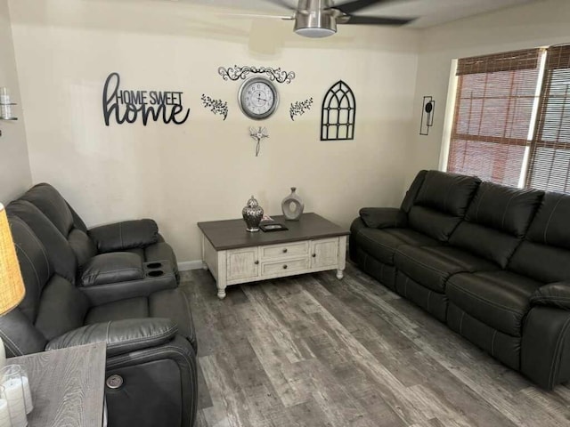 living room featuring ceiling fan and dark hardwood / wood-style flooring