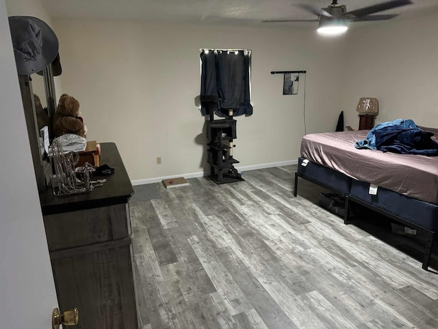 bedroom featuring hardwood / wood-style floors and ceiling fan