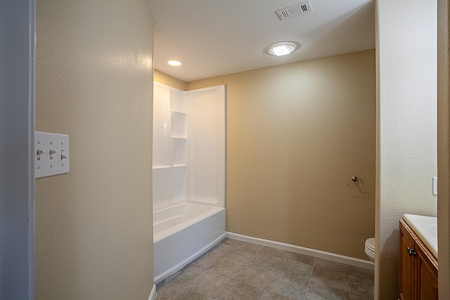 full bathroom with bathtub / shower combination, vanity, and toilet