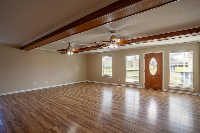 entryway with hardwood / wood-style floors, crown molding, beamed ceiling, and ceiling fan