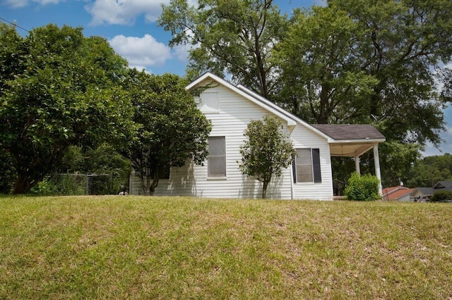 view of property exterior with a lawn