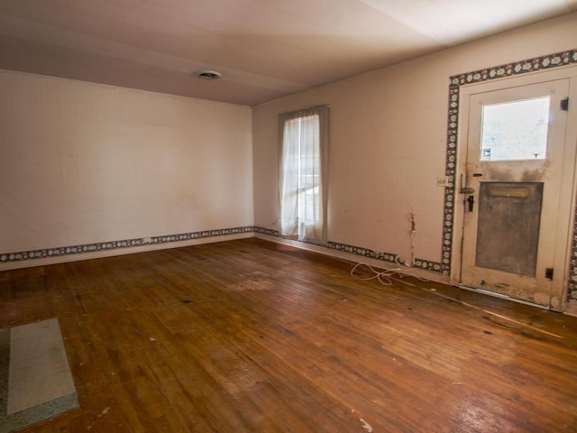 spare room with hardwood / wood-style flooring