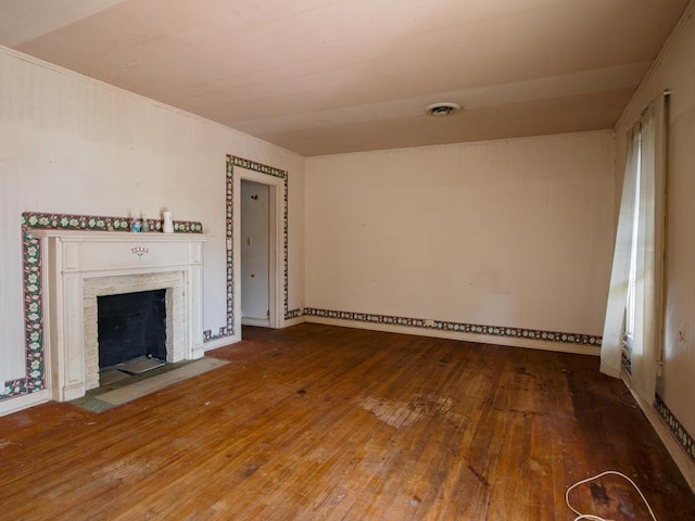 unfurnished living room featuring hardwood / wood-style flooring