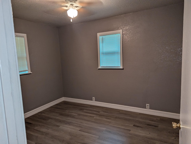 unfurnished room with a textured ceiling, ceiling fan, and dark hardwood / wood-style floors