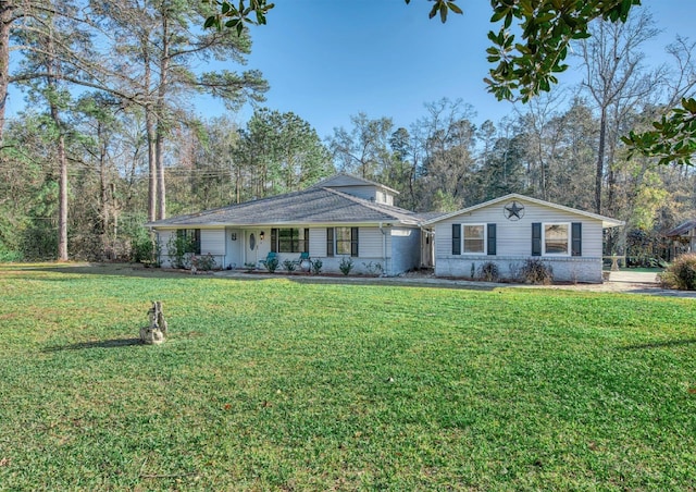 ranch-style home with a front lawn