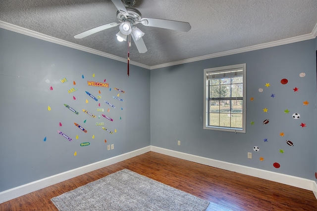 spare room with hardwood / wood-style floors, ceiling fan, crown molding, and a textured ceiling