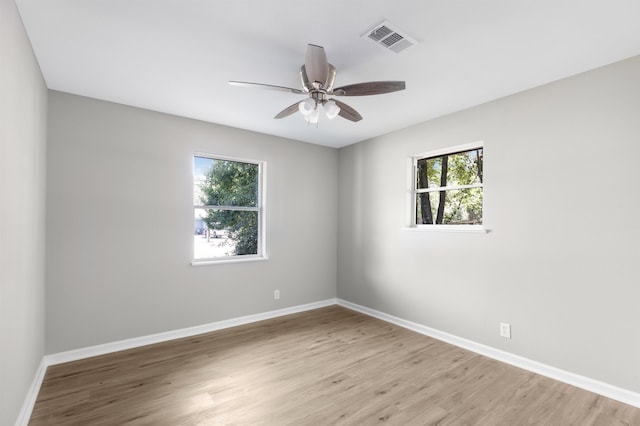 unfurnished room featuring ceiling fan and light hardwood / wood-style flooring