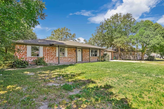 rear view of property with a yard and a garage