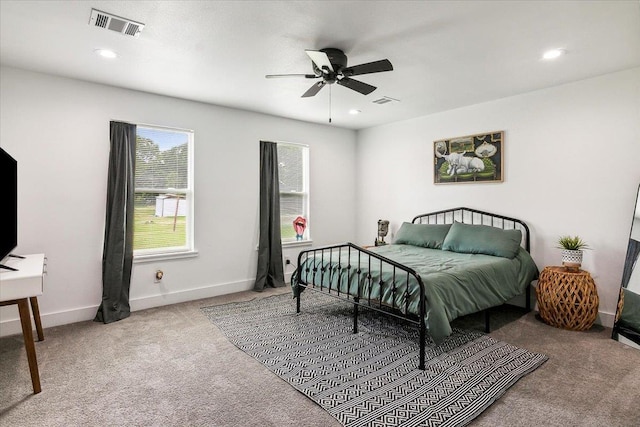 bedroom featuring light carpet and ceiling fan