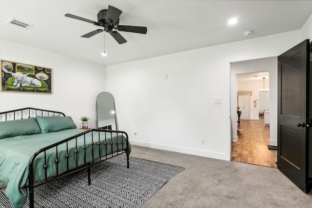 carpeted bedroom featuring ceiling fan