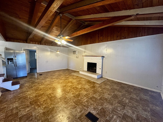 unfurnished living room with a wall mounted air conditioner, wooden ceiling, beamed ceiling, ceiling fan, and a fireplace