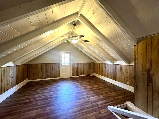 bonus room featuring dark hardwood / wood-style flooring and vaulted ceiling with beams