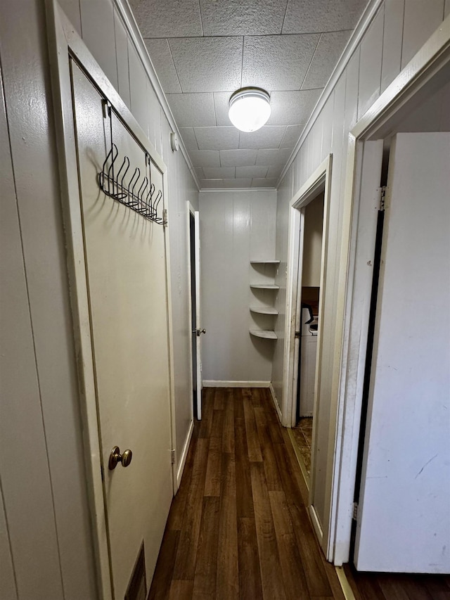 hall with crown molding and dark hardwood / wood-style floors