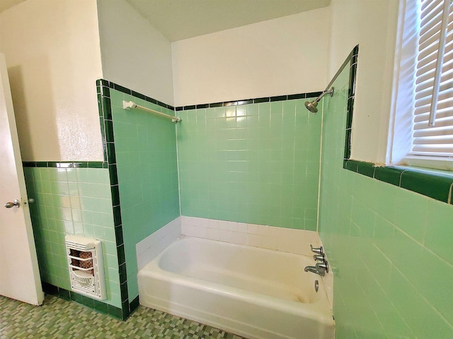 bathroom featuring tile patterned floors, separate shower and tub, tile walls, and heating unit