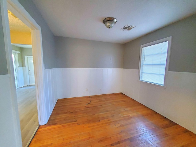 unfurnished room with light hardwood / wood-style flooring