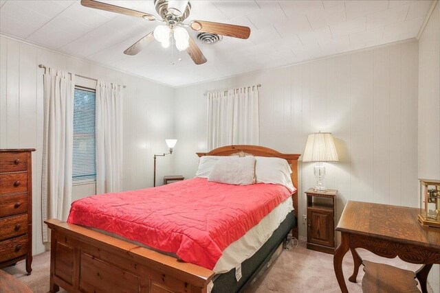 bedroom featuring ceiling fan and light carpet