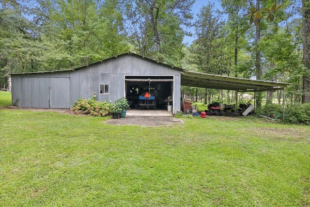 exterior space featuring a garage, a carport, and a lawn