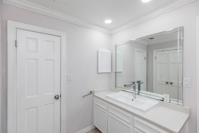 bathroom featuring baseboards, ornamental molding, vanity, and recessed lighting