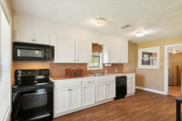 209 Boutwell Rd, Beaumont, TX 77713 - kitchen featuring black appliances, a sink, backsplash, light countertops, and a textured ceiling