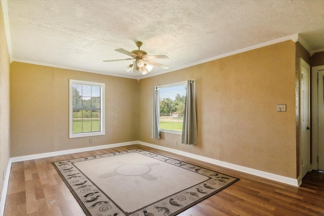 209 Boutwell Rd, Beaumont, TX 77713 - unfurnished room featuring wood finished floors, ornamental molding, baseboards, ceiling fan, and a textured ceiling