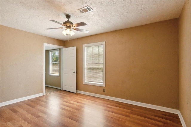 209 Boutwell Rd, Beaumont, TX 77713 - spare room featuring wood finished floors, ceiling fan, baseboards, and a textured ceiling
