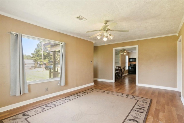 209 Boutwell Rd, Beaumont, TX 77713 - empty room featuring wood finished floors, a ceiling fan, crown molding, baseboards, and a textured ceiling