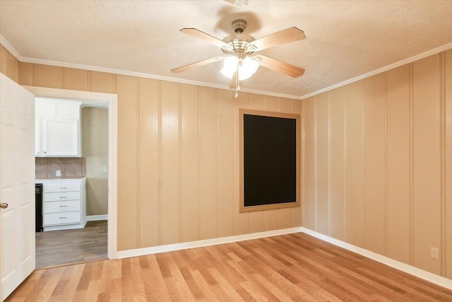 209 Boutwell Rd, Beaumont, TX 77713 - spare room featuring light wood-type flooring, crown molding, ceiling fan, and baseboards
