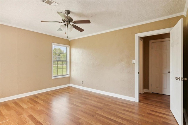 209 Boutwell Rd, Beaumont, TX 77713 - empty room with a textured ceiling, light wood-type flooring, a ceiling fan, baseboards, and crown molding