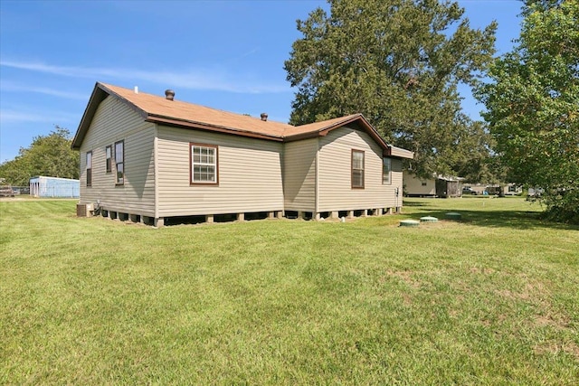209 Boutwell Rd, Beaumont, TX 77713 - view of side of property featuring a lawn and central AC unit
