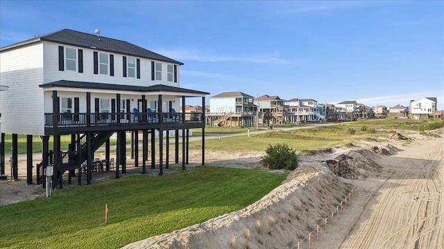 1326 Emerald Dr, Port Bolivar, TX 77650 - view of community with a yard, a residential view, and a deck