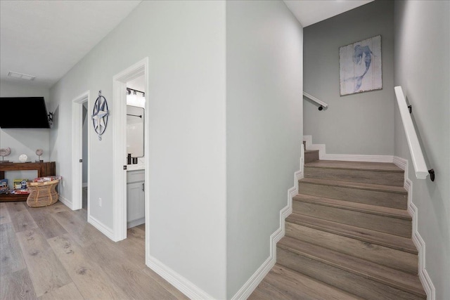 1326 Emerald Dr, Port Bolivar, TX 77650 - staircase with wood finished floors and baseboards